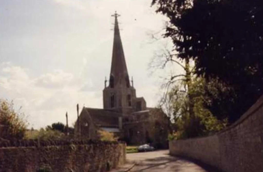 Blurry photo of Bampton Church from a side street view